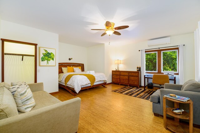 76-6319 Leone St, Kailua-Kona, HI 96740 - bedroom with a wall mounted AC, wood finished floors, and ceiling fan
