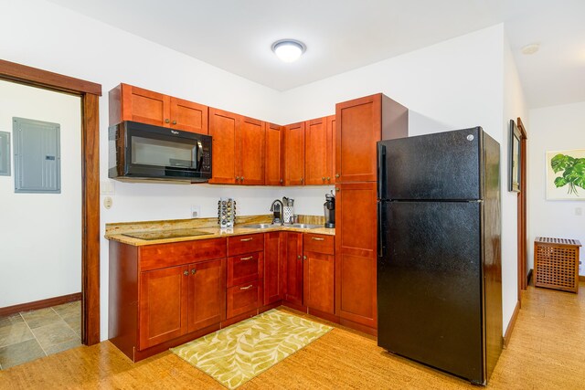 76-6319 Leone St, Kailua-Kona, HI 96740 - kitchen with black appliances, electric panel, a sink, light countertops, and baseboards