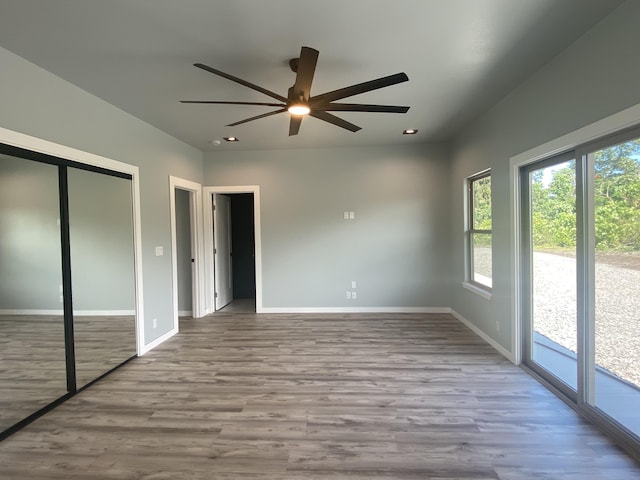 16-1657 34th Ave, Keaau, HI 96760 - unfurnished bedroom featuring access to exterior, wood finished floors, baseboards, recessed lighting, and ceiling fan