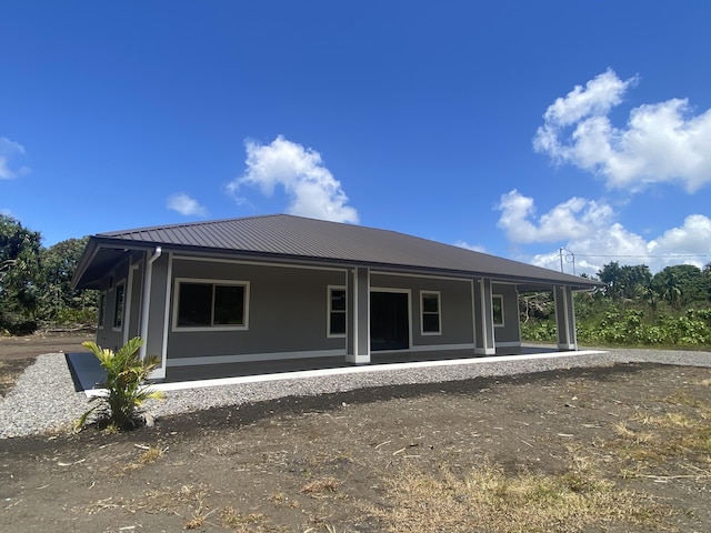 16-1657 34th Ave, Keaau, HI 96760 - rear view of property with covered porch and metal roof