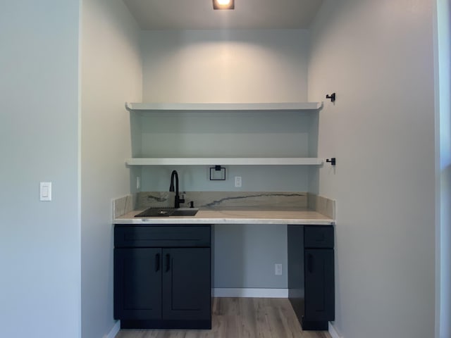 16-1657 34th Ave, Keaau, HI 96760 - unfurnished office with a sink, light wood-style flooring, and baseboards