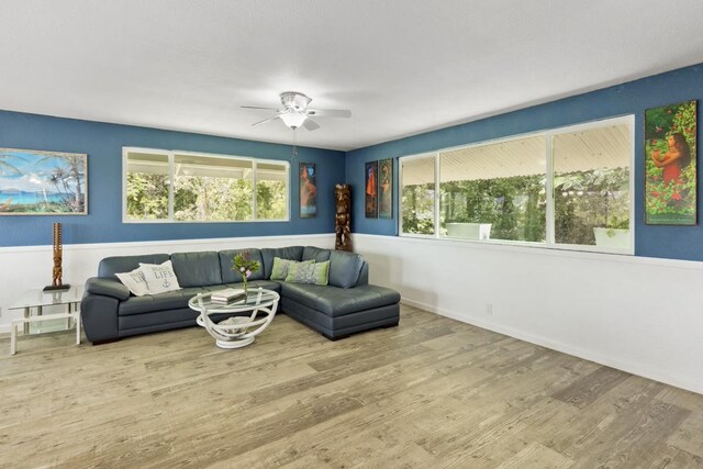 15-1653 28th Ave, Keaau, HI 96749 - living room with wood finished floors, a ceiling fan, and baseboards