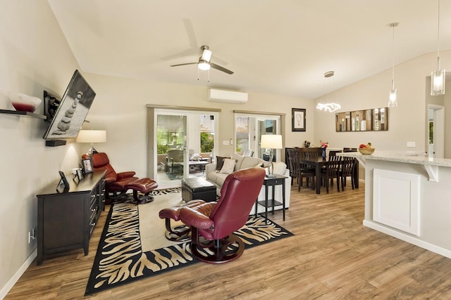 16-2081 Ohia Dr, Pahoa, HI 96778 - living area featuring an AC wall unit, wood finished floors, a ceiling fan, and lofted ceiling