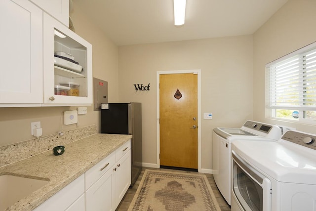 16-2081 Ohia Dr, Pahoa, HI 96778 - laundry area with washing machine and dryer, cabinet space, electric panel, and light tile patterned floors