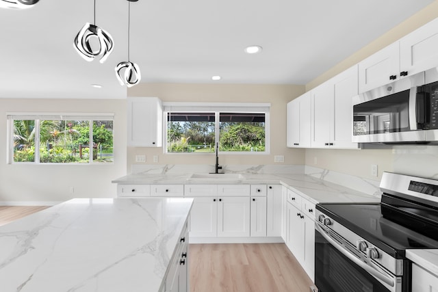 16-2147 Stardust Dr, Pahoa, HI 96778 - kitchen featuring stainless steel appliances, a sink, plenty of natural light, light wood-type flooring, and recessed lighting