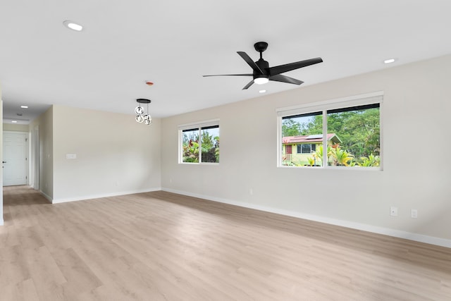 16-2147 Stardust Dr, Pahoa, HI 96778 - spare room with light wood-style flooring, baseboards, ceiling fan, and recessed lighting