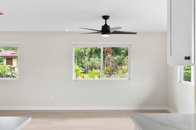 16-2147 Stardust Dr, Pahoa, HI 96778 - unfurnished bedroom with baseboards, wood finished floors, and a ceiling fan