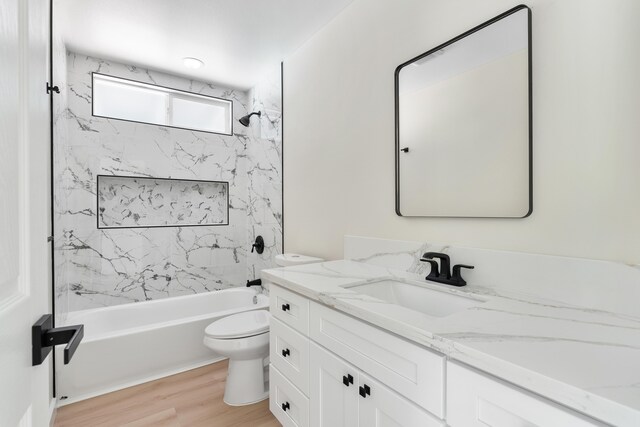 16-2147 Stardust Dr, Pahoa, HI 96778 - full bath featuring vanity, toilet, bathing tub / shower combination, and wood finished floors