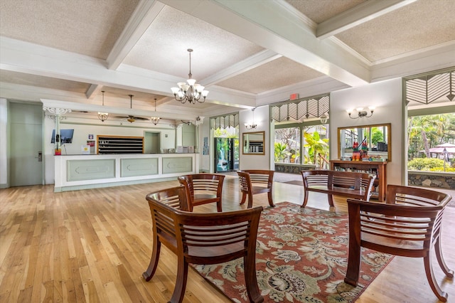 75-5776 Kuakini Hwy Unit 123, Kailua-Kona, HI 96740 - living room with coffered ceiling, plenty of natural light, beam ceiling, wood-type flooring, and a chandelier