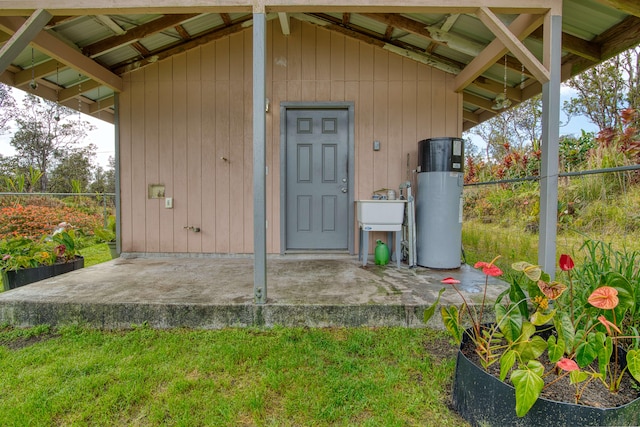 11-3258 Pa Alii St, Volcano, HI 96785 - doorway to property featuring water heater and a sink
