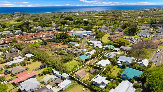 3184-B Hikina Rd, Koloa, HI 96756 - aerial view of property and surrounding area featuring property boundaries highlighted, a large body of water, and nearby suburban area