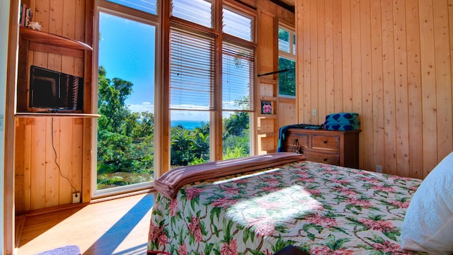 27-577 Old Mamalahoa Hwy Unit 2, Papaikou, HI 96781 - bedroom featuring wood walls and wood finished floors