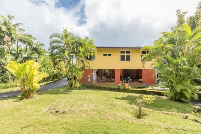 27-577 Old Mamalahoa Hwy Unit 2, Papaikou, HI 96781 - rear view of house featuring a yard