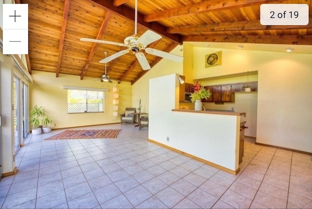 15-473 Anae St, Pahoa, HI 96778 - living area featuring wooden ceiling with exposed beams, ceiling fan, light tile patterned flooring, baseboards, and high vaulted ceiling