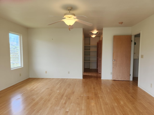 15-974 Lemiwai Rd, Keaau, HI 96749 - spare room with light wood finished floors, ceiling fan, baseboards, and a smoke detector