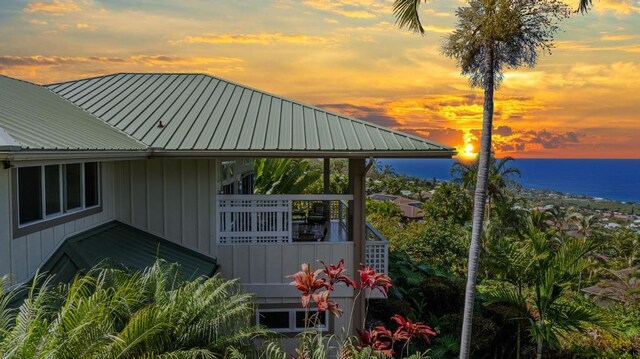 76-985 Aeo St, Kailua-Kona, HI 96740 - view of property exterior with a water view and metal roof