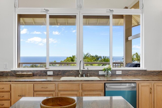 76-985 Aeo St, Kailua-Kona, HI 96740 - kitchen with stainless steel dishwasher, a sink, light brown cabinetry, and dark stone countertops