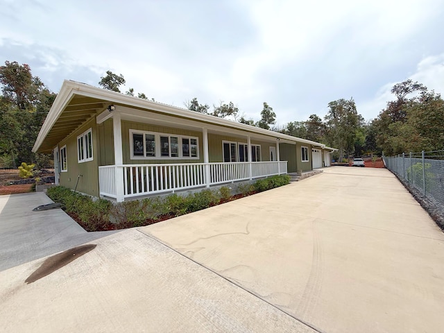 92-8858 Paradise Pkwy, Ocean View, HI 96737 - view of front of house featuring a porch and concrete driveway