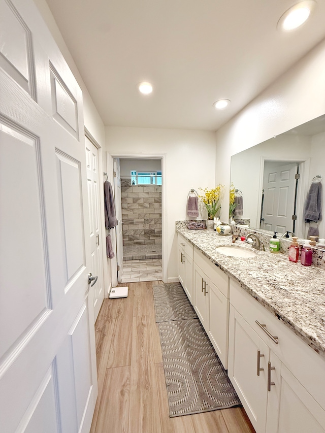 92-8858 Paradise Pkwy, Ocean View, HI 96737 - full bath featuring vanity, a stall shower, wood finished floors, and recessed lighting
