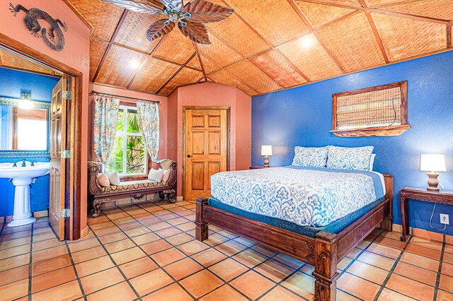 15-869 Lemiwai Rd, Keaau, HI 96749 - bedroom featuring vaulted ceiling, light tile patterned floors, and a textured wall
