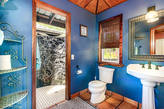 15-869 Lemiwai Rd, Keaau, HI 96749 - full bathroom with toilet, tile patterned flooring, baseboards, and a shower