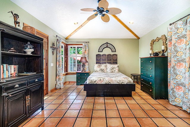 15-869 Lemiwai Rd, Keaau, HI 96749 - bedroom with lofted ceiling, light tile patterned floors, ceiling fan, and baseboards