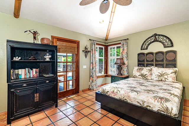 15-869 Lemiwai Rd, Keaau, HI 96749 - bedroom featuring multiple windows, tile patterned flooring, and a ceiling fan