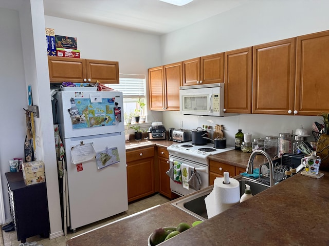 73-1111 Nuuanu Pl Unit N103, Kailua-Kona, HI 96740 - kitchen with white appliances, brown cabinets, and dark countertops