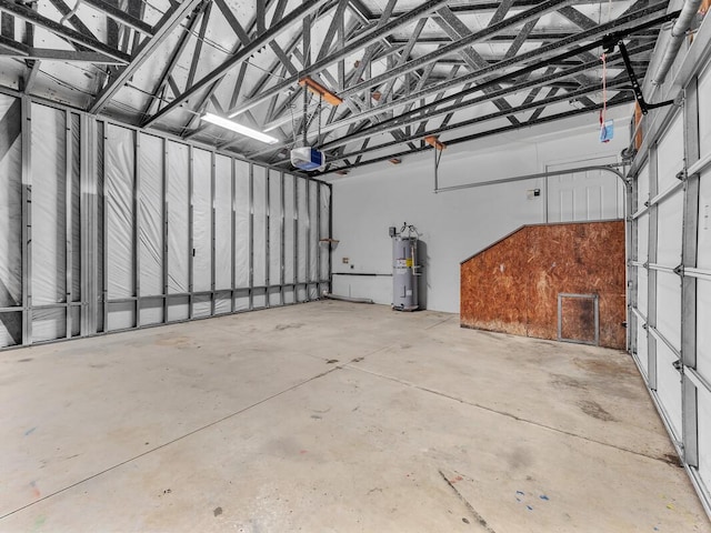94-1727 Kaulua St, Naalehu, HI 96772 - garage with a garage door opener and electric water heater