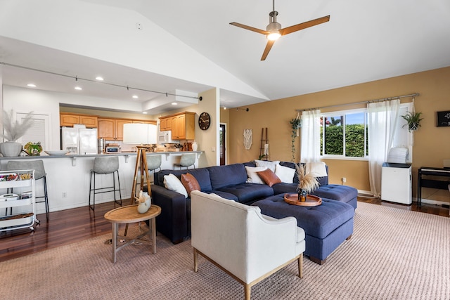 76-6398 Pualani St Unit 7, Kailua-Kona, HI 96740 - living room featuring wood finished floors, vaulted ceiling, ceiling fan, and baseboards