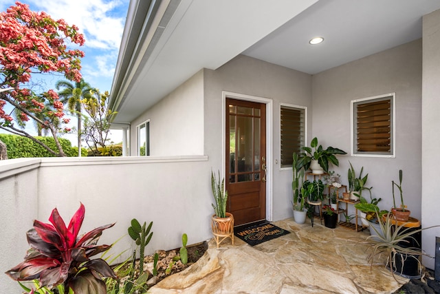 76-6398 Pualani St Unit 7, Kailua-Kona, HI 96740 - property entrance featuring stucco siding and a patio