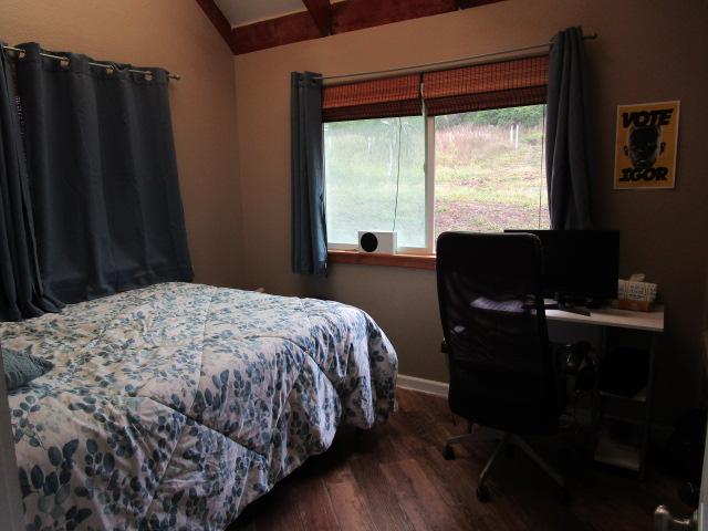 89-902 Rd Rd, Captain Cook, HI 96704 - bedroom with wood finished floors, baseboards, and an office area