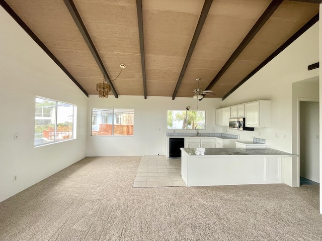 76-197 Kealoha St, Kailua-Kona, HI 96740 - kitchen with a sink, open floor plan, stainless steel microwave, dishwasher, and light colored carpet