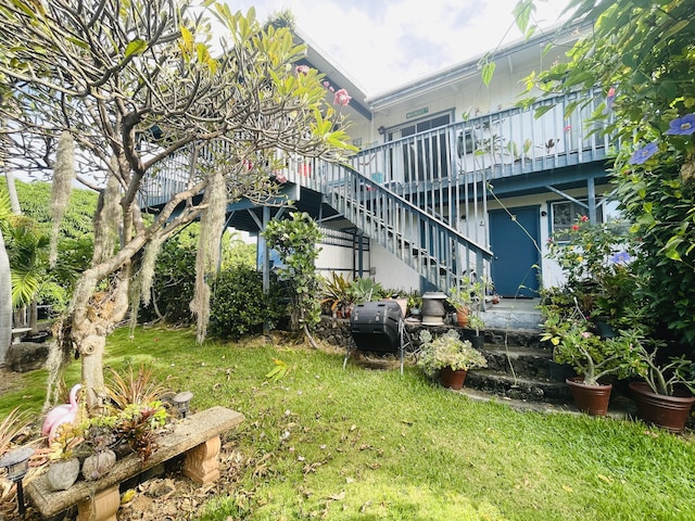 76-197 Kealoha St, Kailua-Kona, HI 96740 - view of green lawn featuring stairway and a deck