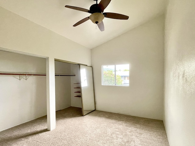 76-197 Kealoha St, Kailua-Kona, HI 96740 - unfurnished bedroom with multiple closets, light carpet, ceiling fan, and high vaulted ceiling