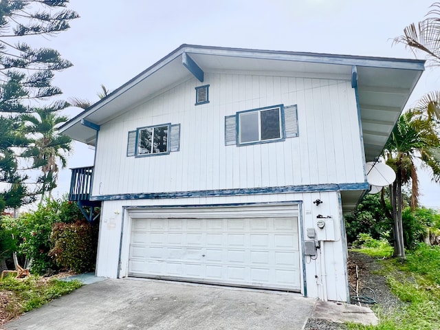 76-197 Kealoha St, Kailua-Kona, HI 96740 - view of front of property featuring a garage and concrete driveway