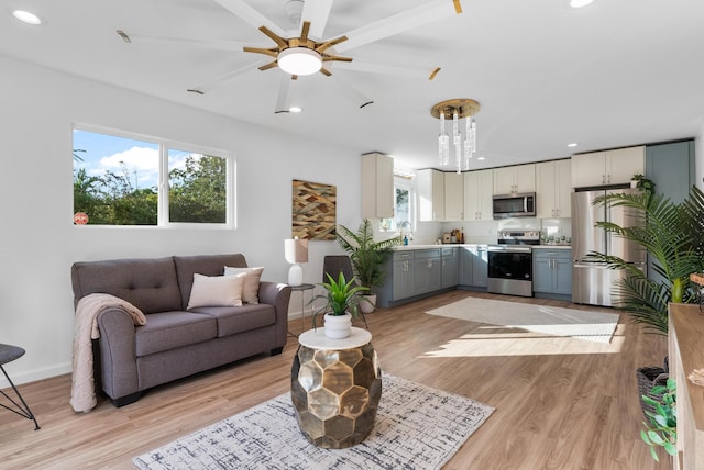 16-2143 Uilani Dr, Pahoa, HI 96778 - living area with light wood-type flooring, recessed lighting, ceiling fan, and baseboards