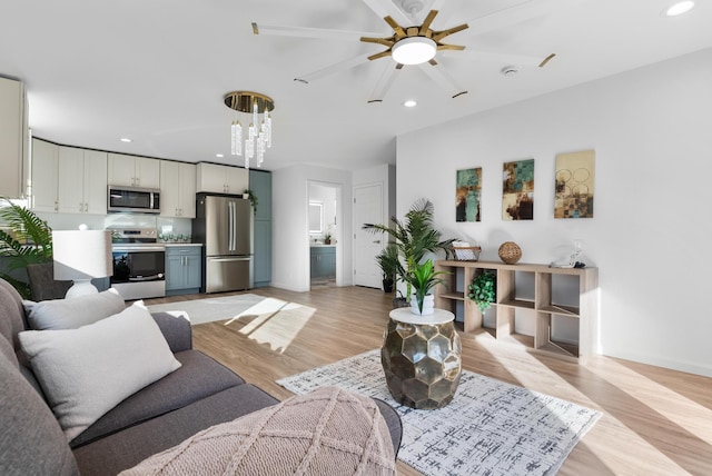 16-2143 Uilani Dr, Pahoa, HI 96778 - living room with light wood-style floors, recessed lighting, a ceiling fan, and baseboards