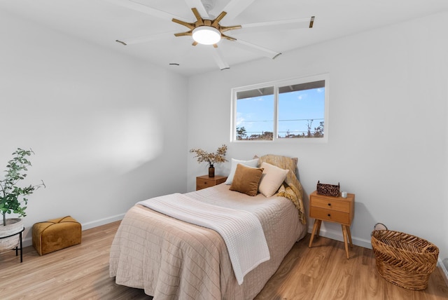 16-2143 Uilani Dr, Pahoa, HI 96778 - bedroom with light wood finished floors, baseboards, and ceiling fan