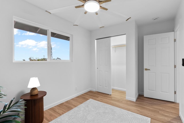 16-2143 Uilani Dr, Pahoa, HI 96778 - bedroom with light wood-style floors, a closet, baseboards, and a ceiling fan