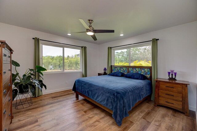 16-1516 Pohaku Cir, Keaau, HI 96749 - bedroom with wood finished floors, multiple windows, baseboards, recessed lighting, and a ceiling fan