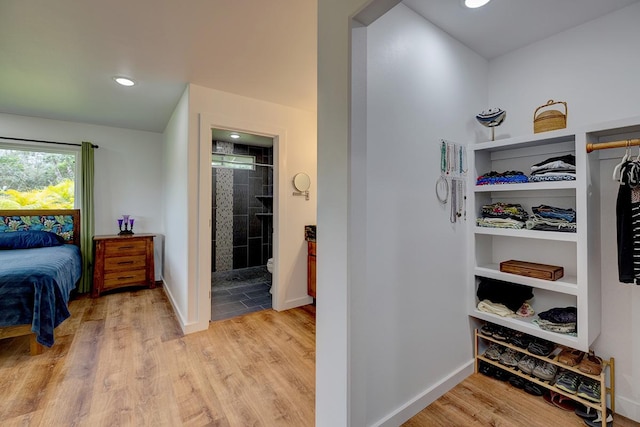 16-1516 Pohaku Cir, Keaau, HI 96749 - bedroom featuring light wood-style floors, baseboards, recessed lighting, and ensuite bathroom