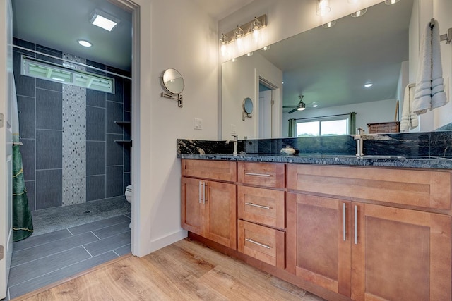 16-1516 Pohaku Cir, Keaau, HI 96749 - full bath with wood finished floors, ceiling fan, double vanity, toilet, and tiled shower