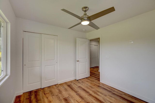 16-1516 Pohaku Cir, Keaau, HI 96749 - unfurnished bedroom featuring light wood-style flooring, baseboards, a closet, and ceiling fan