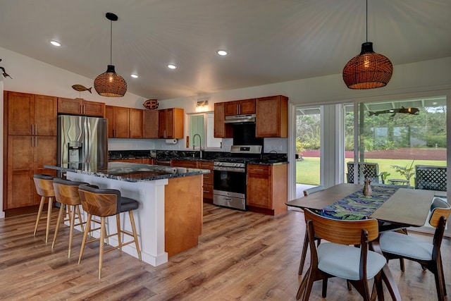 16-1516 Pohaku Cir, Keaau, HI 96749 - kitchen featuring appliances with stainless steel finishes, a sink, lofted ceiling, a center island, and decorative light fixtures
