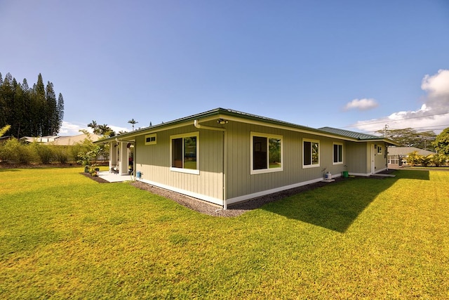 16-1516 Pohaku Cir, Keaau, HI 96749 - rear view of property with a yard