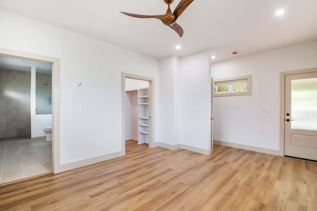 4306 Pilimai St, Lihue, HI 96766 - unfurnished bedroom featuring light wood-type flooring, connected bathroom, a walk in closet, recessed lighting, and ceiling fan
