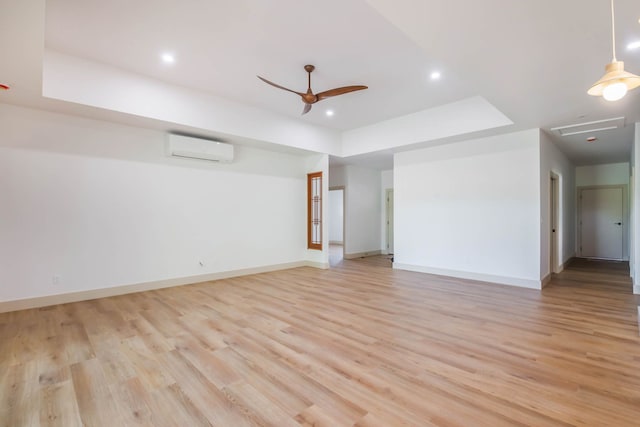 4306 Pilimai St, Lihue, HI 96766 - unfurnished room featuring a wall unit AC, a raised ceiling, light wood-style flooring, a ceiling fan, and recessed lighting