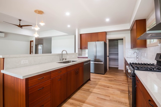 4306 Pilimai St, Lihue, HI 96766 - kitchen with wall chimney exhaust hood, stainless steel appliances, backsplash, light wood-style flooring, and recessed lighting