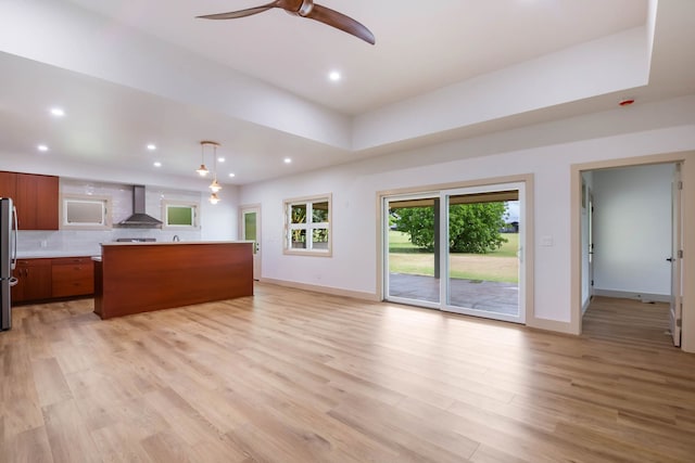 4306 Pilimai St, Lihue, HI 96766 - unfurnished living room with ceiling fan, light wood-type flooring, recessed lighting, and a tray ceiling